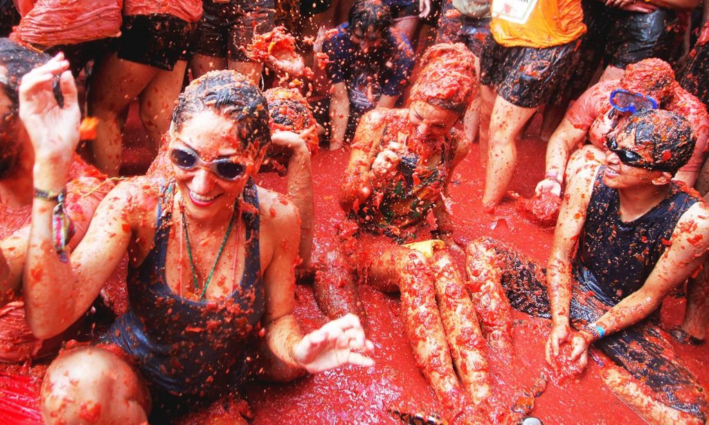 Revellers battle with tomato pulp during the annual ‘Tomatina’ festival in Bunol near Valencia